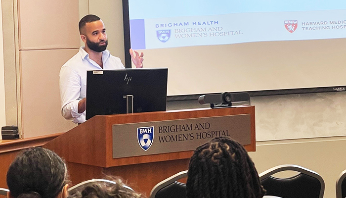 Medical professional presenting at a podium