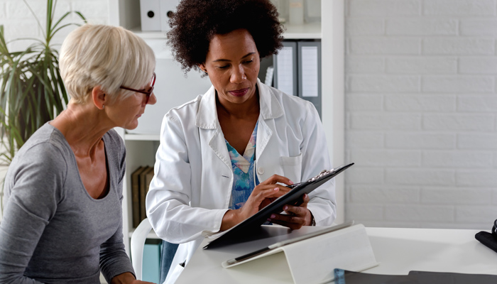 female provider with senior patient