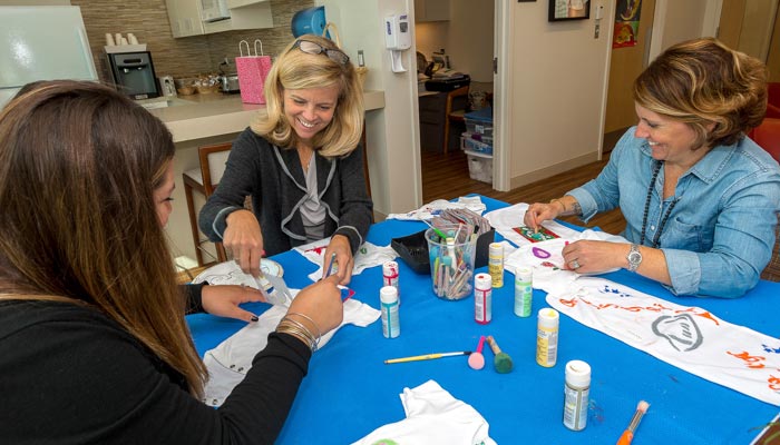 Family members and supervised siblings can create a beautiful onesie for their little NICU miracle.