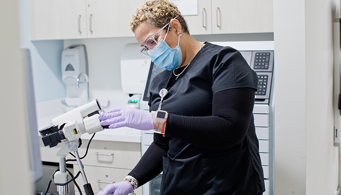 female staff member preparing equipment