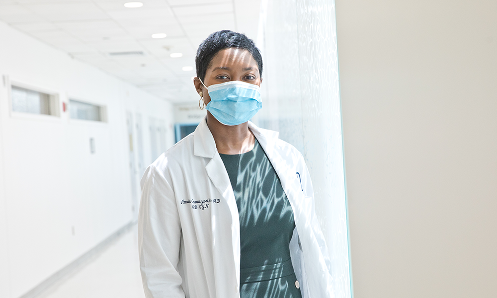 female doctor wearing mask in hallway