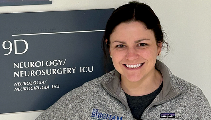 Nurse standing near neurology sign